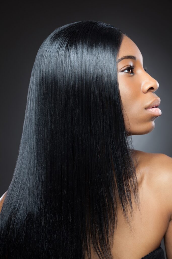 Beautiful young black woman with long straight hair